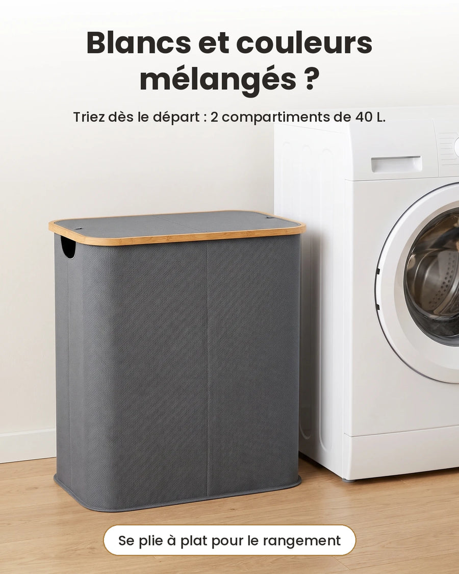Panier à linge pliable 80 L gris à 2 compartiments à côté d'un lave-linge, pour trier le linge blanc et de couleur